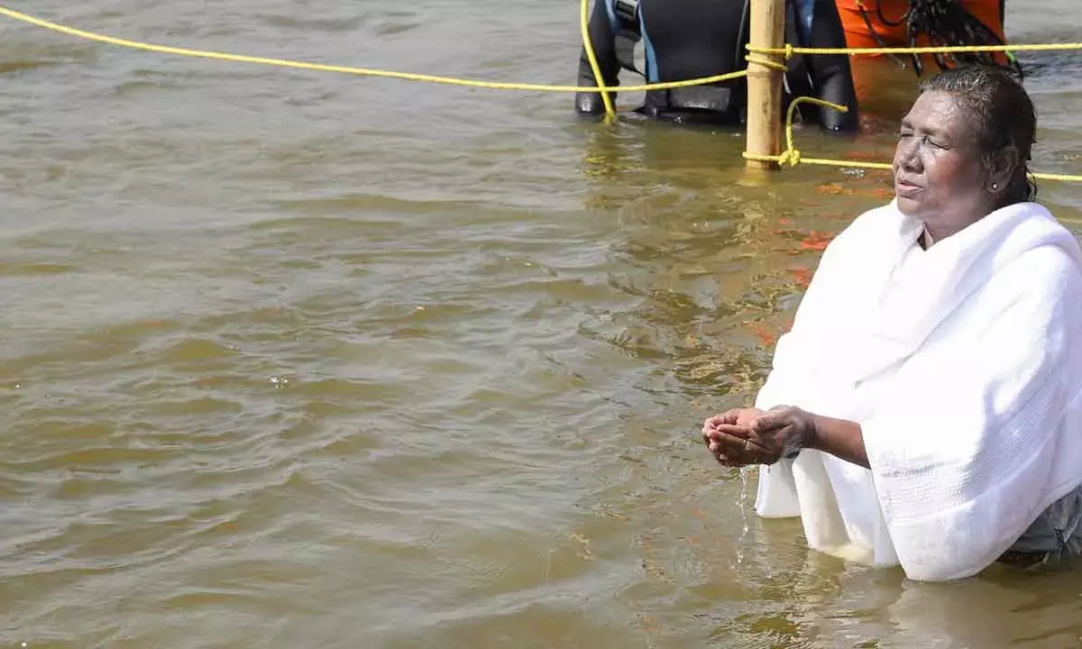 Prez Murmu Takes Holy Dip At Sangam