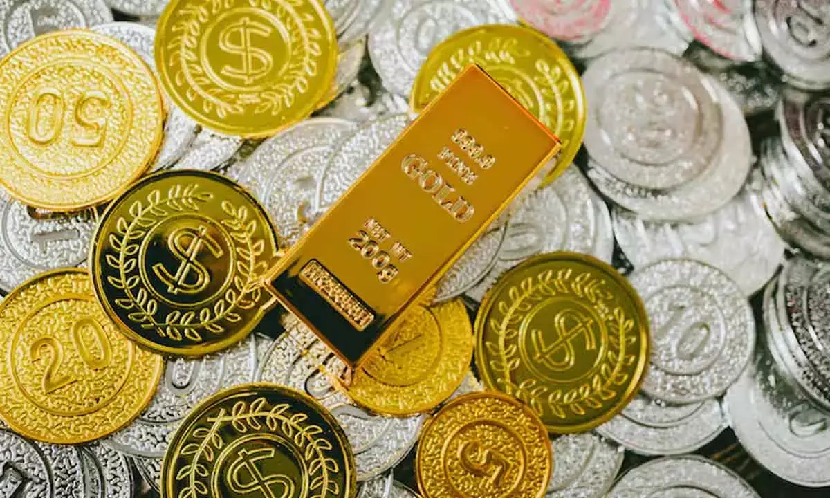 Gold rises Rs 100, silver remains flat