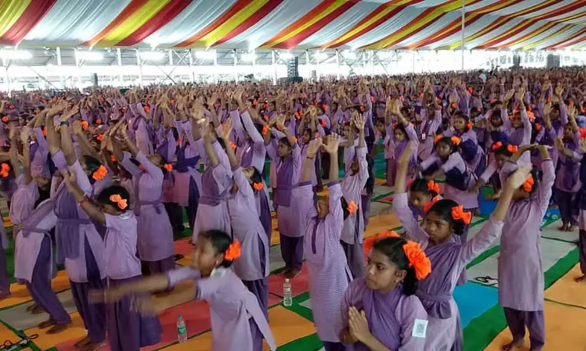 Tribal Students in Vizag Aim for World Record with 108 Surya Namaskarams