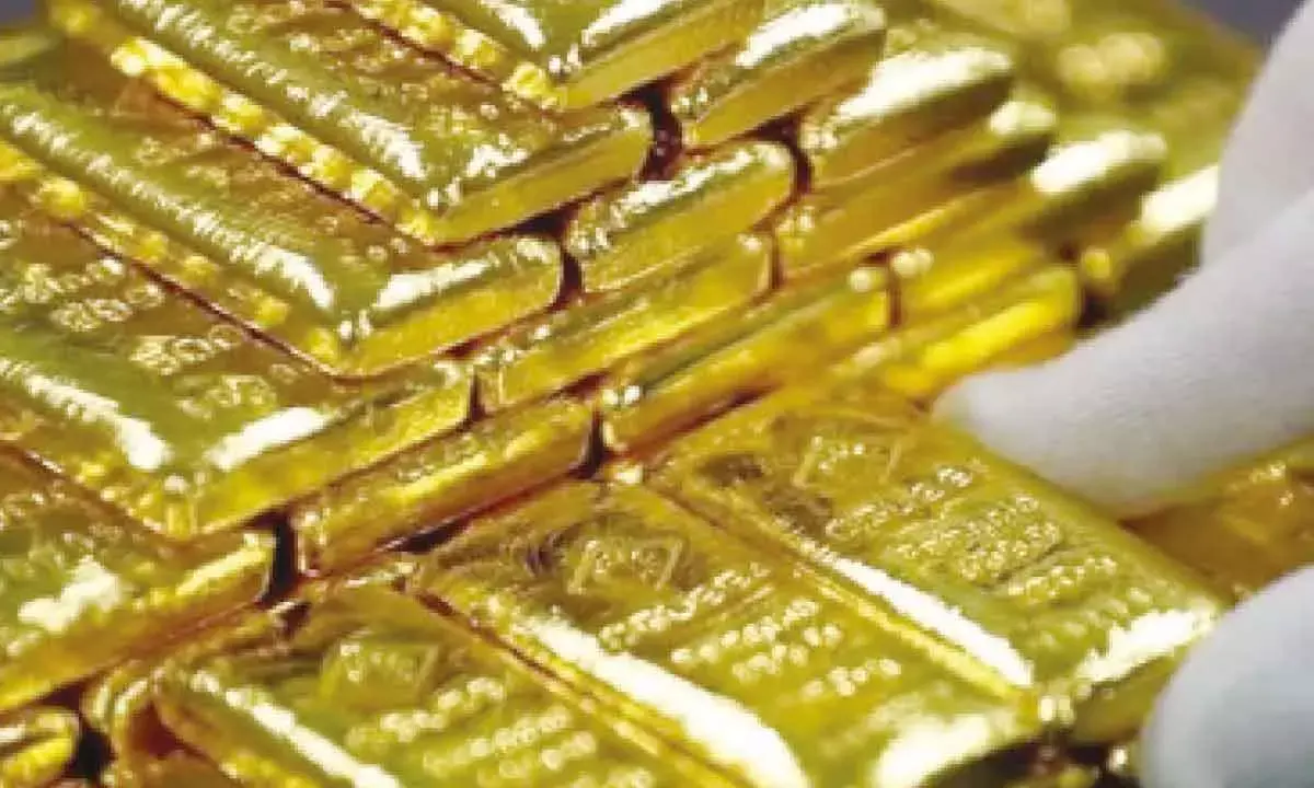 Gold prices dip as strong dollar, weak global sentiment drag