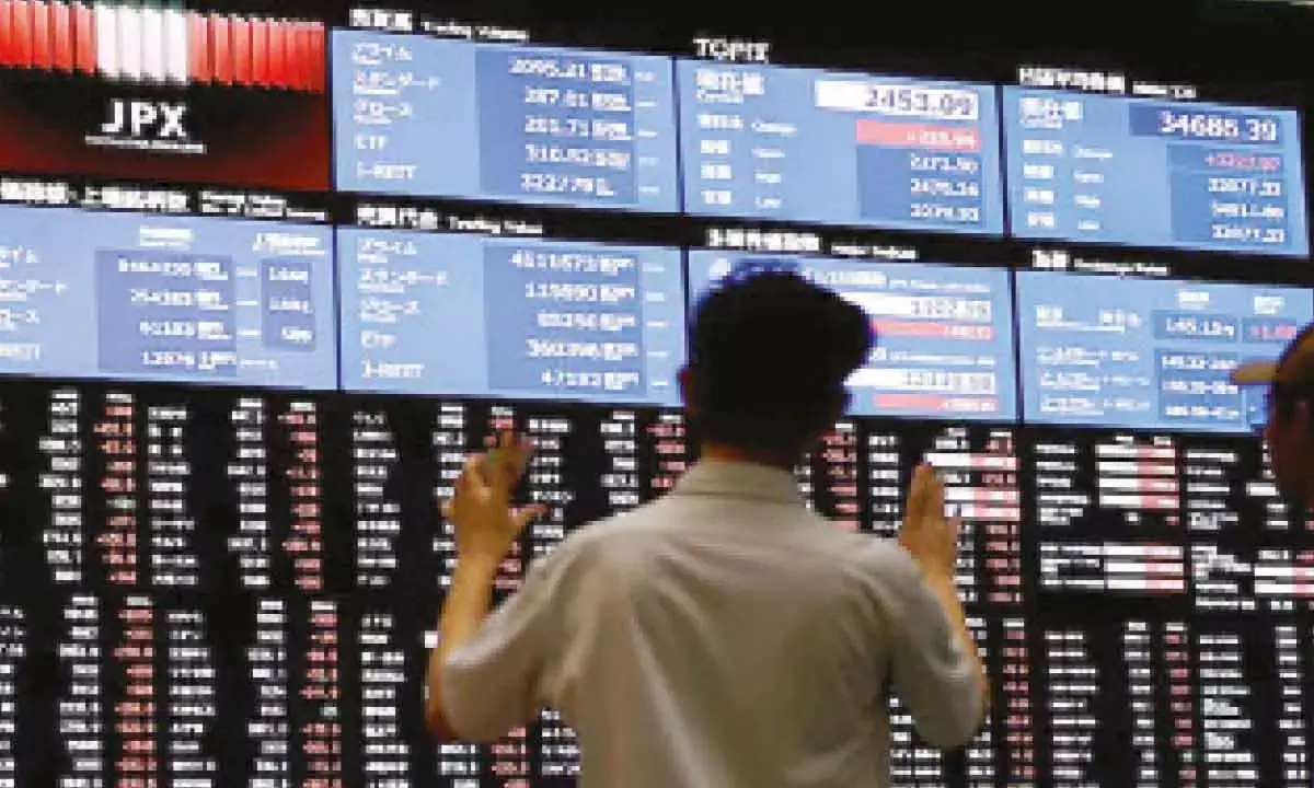 Asian shares advance as tech shares rebound from AI jitters