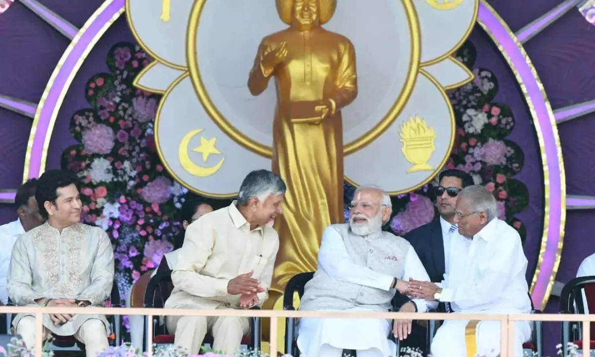 Sathya Sai anni fete: Modi releases `100 commemorative coin, postal stamp
