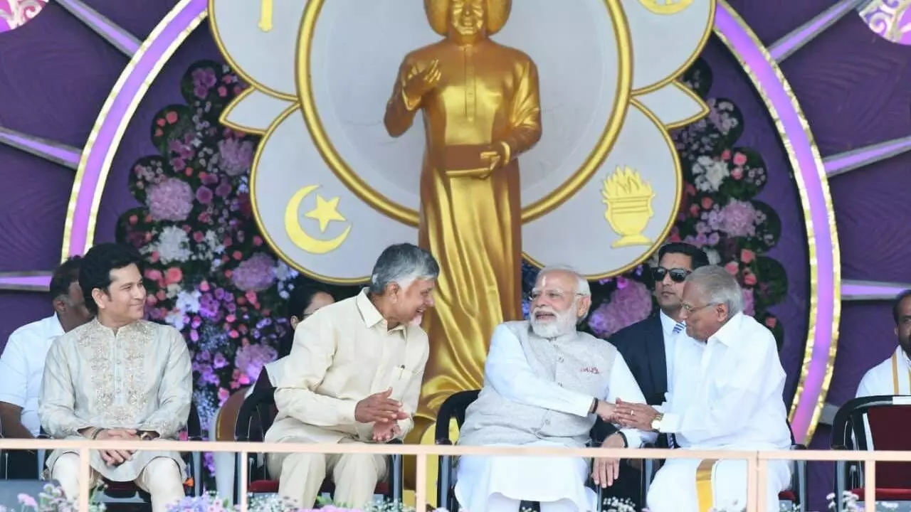 Sathya Sai anni fete: Modi releases `100 commemorative coin, postal stamp