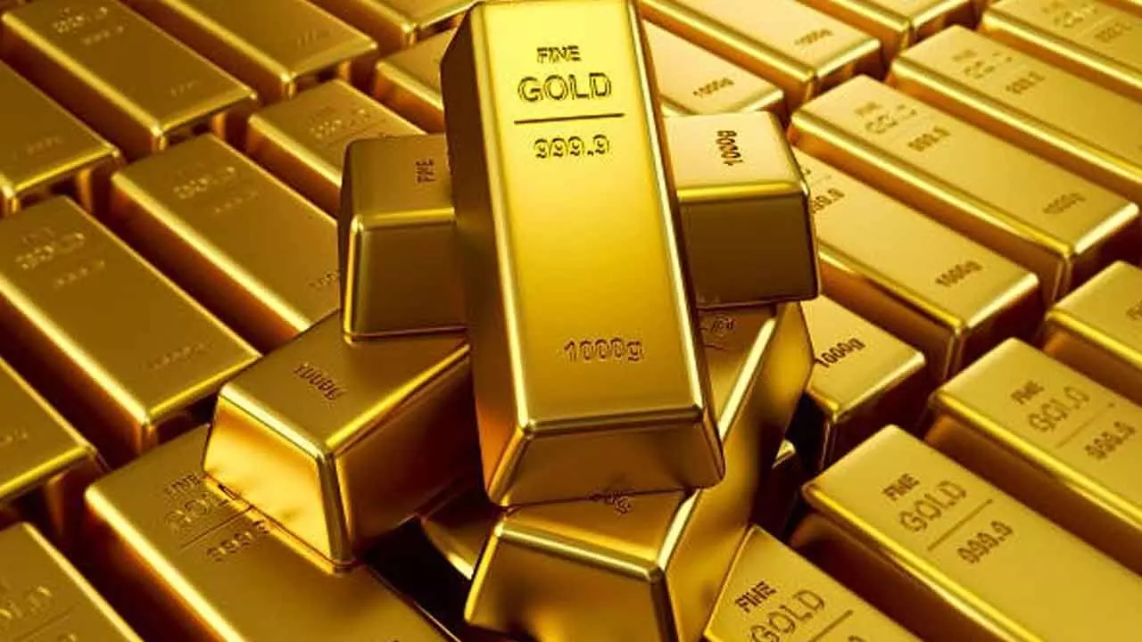 Gold futures slide 1 pc on strong dollar, US data worries curb investor demand